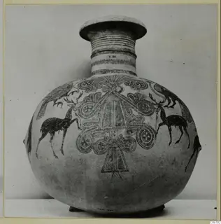 Bichrome IV jug with deer, birds and spiral motifs on a globular body, photographed against a plain background.