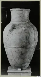 Pottery Pithos Ware: large pale jar with grooved arched and horizontal bands, on a white pedestal