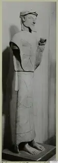 Terracotta statue of a bearded standing figure from Ayia Irini, shown in profile and mended from broken pieces
