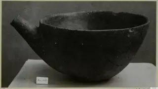 Red Polished I pottery vessel with a short side spout and a wide open mouth