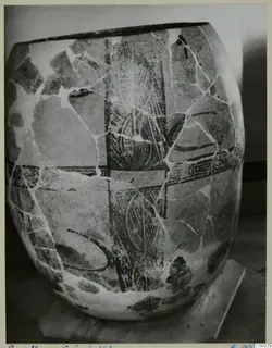 Stone Age pottery vessel from Erimi, broken and mended, with dark painted bands and a vertical patterned panel