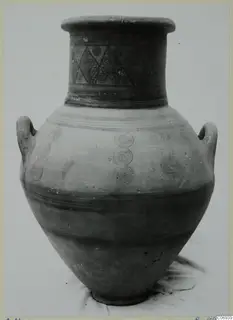 Two-handled painted jar with lozenges and concentric circles on the neck and concentric circles on the body.