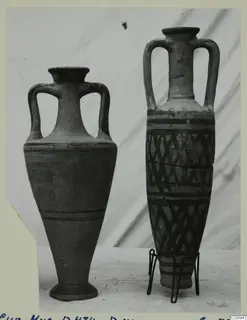 Two two-handled pottery vessels side by side, the right one with a painted lattice and band pattern.