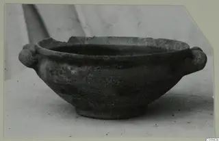 Hellenistic bowl with two small knob handles, shown in side view
