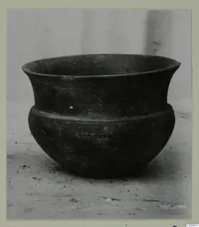 Hellenistic Wares bowl: dark pottery bowl with a flaring rim and a ridge around the shoulder