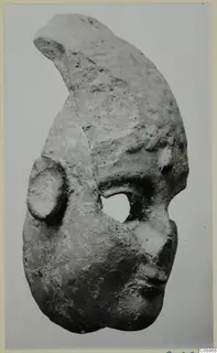 Terracotta fragment from Vasilika with a curved upper part, a rounded opening and a raised knob on one side
