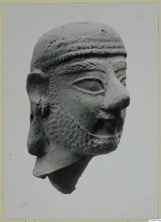 Terracotta head of a bearded man from Vasilika, with a banded headband and incised beard, neck broken off