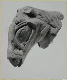 Fragment of a terracotta sculpture showing a rounded eye, a blunt muzzle and ridged shapes, Vasilika 1