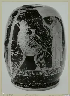 Red-figure pottery vessel with a seated bearded figure and a standing figure on a dark ground, key-pattern border below
