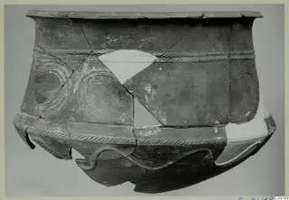 Pottery Base-Ring Ware vessel, reconstructed from fragments, with rope-moulded bands and looped decoration on the body
