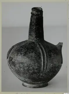 Pottery Base-Ring Ware jug with a tall neck and side spout, shown alone