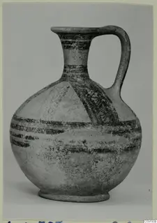 Pottery Bichrome Wheel-made jug with a strap handle and dark painted bands