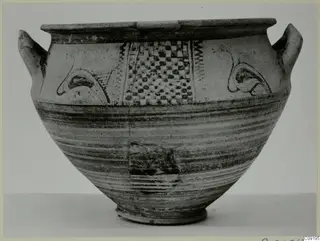 White Painted wheel-made vessel with two handles and dark painted panels of dots, arcs and zigzags