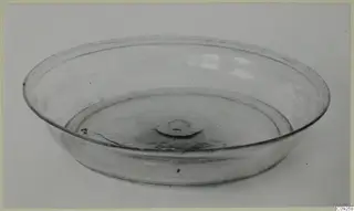 Shallow blown glass bowl with a central pontil mark, shown on a pale background.
