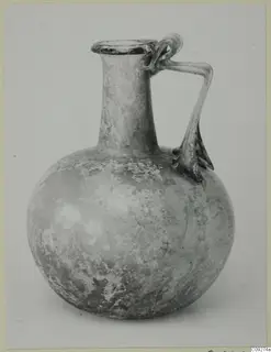 Blown glass jug with a round body, long neck and handles
