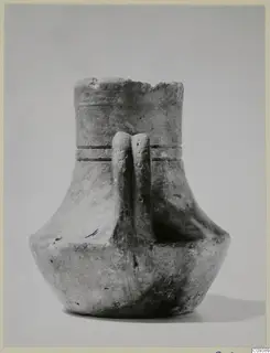 Unpainted pottery jar with a wide mouth, two vertical strap handles and two horizontal grooves on the neck.