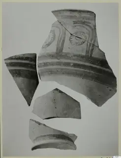 Four pottery sherds, one with painted bands and circular motifs, from the Levanto-Helladic series