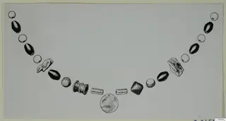 Field drawing of a necklace of beads and a round pendant, laid out in a curve across a pale card
