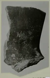 Levanto-Helladic sherd, a curved fragment of a vessel wall with a dark surface and pale patches