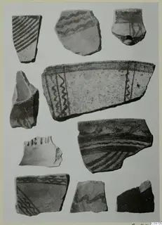 Several painted pottery sherds on a pale card, with dark bands, wavy lines and diagonal hatching. Lev. Hell. sherds
