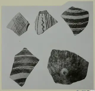 Five pottery sherds with painted bands, wavy lines and crosshatching, laid out on a grey background.
