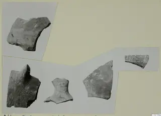 Five pottery sherds from Ayios Iakovos, some with striped or hatched bands, mounted on a card