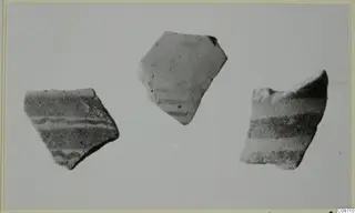 Three painted pottery sherds, Lev. Hell. Sherds, on a plain grey background