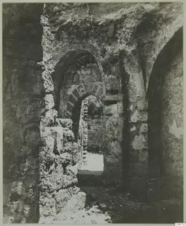 Stone arches and masonry walls in a ruined building in the Kyrenia Mountains