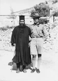 Papa Polivios and Einar Gjerstad standing together in a village street in Mandres, Ayios Iakovos