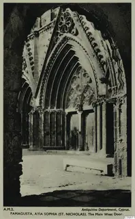 Central west doorway of St Nicholas cathedral in Famagusta, with a deep pointed arch, carved mouldings and a rose window above