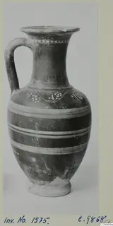Jar with a single loop handle, white painted bands around the body and a wavy dotted pattern on the shoulder.