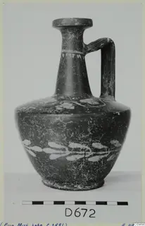 Dark-surfaced jug with a single loop handle and white painted leaf pattern on the body, Cypro-Hell.I pot