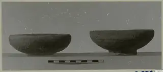 Two pottery bowls photographed side by side, with a scale bar in front of them