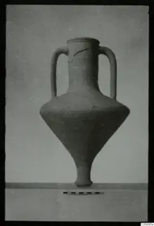 Two-handled jar with a narrow neck and tapering body, shown against a plain background beside a scale bar