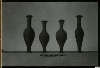 Four jugs and vases from Ajii Omologitades, Politiko and Limassol Oasis standing in a row beside a scale bar.
