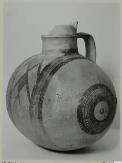 White Painted III-1 jug with a strap handle and dark concentric circle and banded patterns
