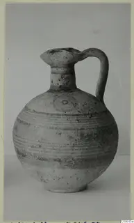 Pottery Bichrome V jug with a single loop handle and horizontal bands of paint