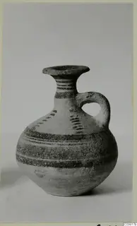 Bichrome IV jug with a single loop handle and dark painted bands, shown against a plain background