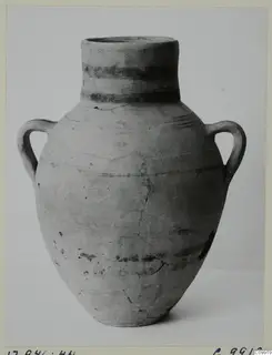 Two-handled pottery jar with dark painted bands on the neck and body