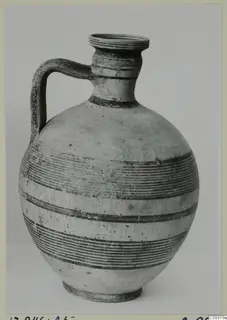 Jug with a single strap handle, a round body and horizontal bands of painted lines