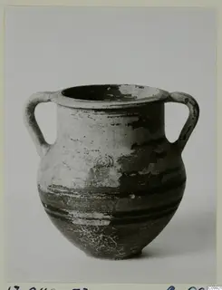 Two-handled amphoriskos with dark painted horizontal bands and flaking paint