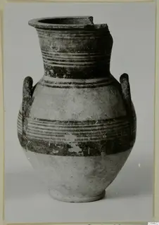 Two-handled painted pottery vessel with horizontal bands, rim broken on one side