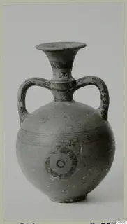 Painted pottery two-handled vessel with a trumpet neck, concentric circles and horizontal bands on the body