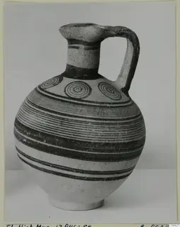 Bichrome IV jug with a single loop handle, horizontal dark bands and concentric circles on the shoulder
