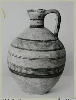 Jug with a single strap handle and dark painted bands, Pottery Black-on-Red II-IV
