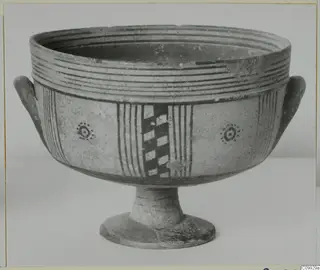 Footed bowl with two side handles, painted with stripes, a checkerboard panel and dotted ring motifs