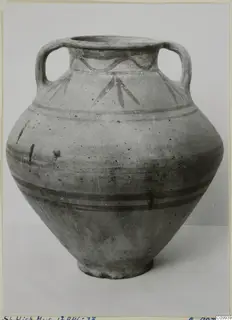White Painted V amphora with two handles, painted bands around the body and leaf-like motifs on the shoulder