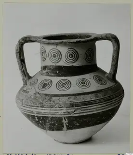 Two-handled pottery vessel with concentric circles on the neck and shoulder and painted bands on the body