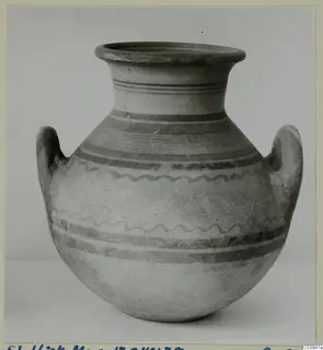 Pottery Bichrome V jar with two handles, banded and wavy painted decoration on a light ground.
