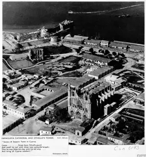Aerial view of Famagusta cathedral and Othello's tower, with the town streets and the sea beyond